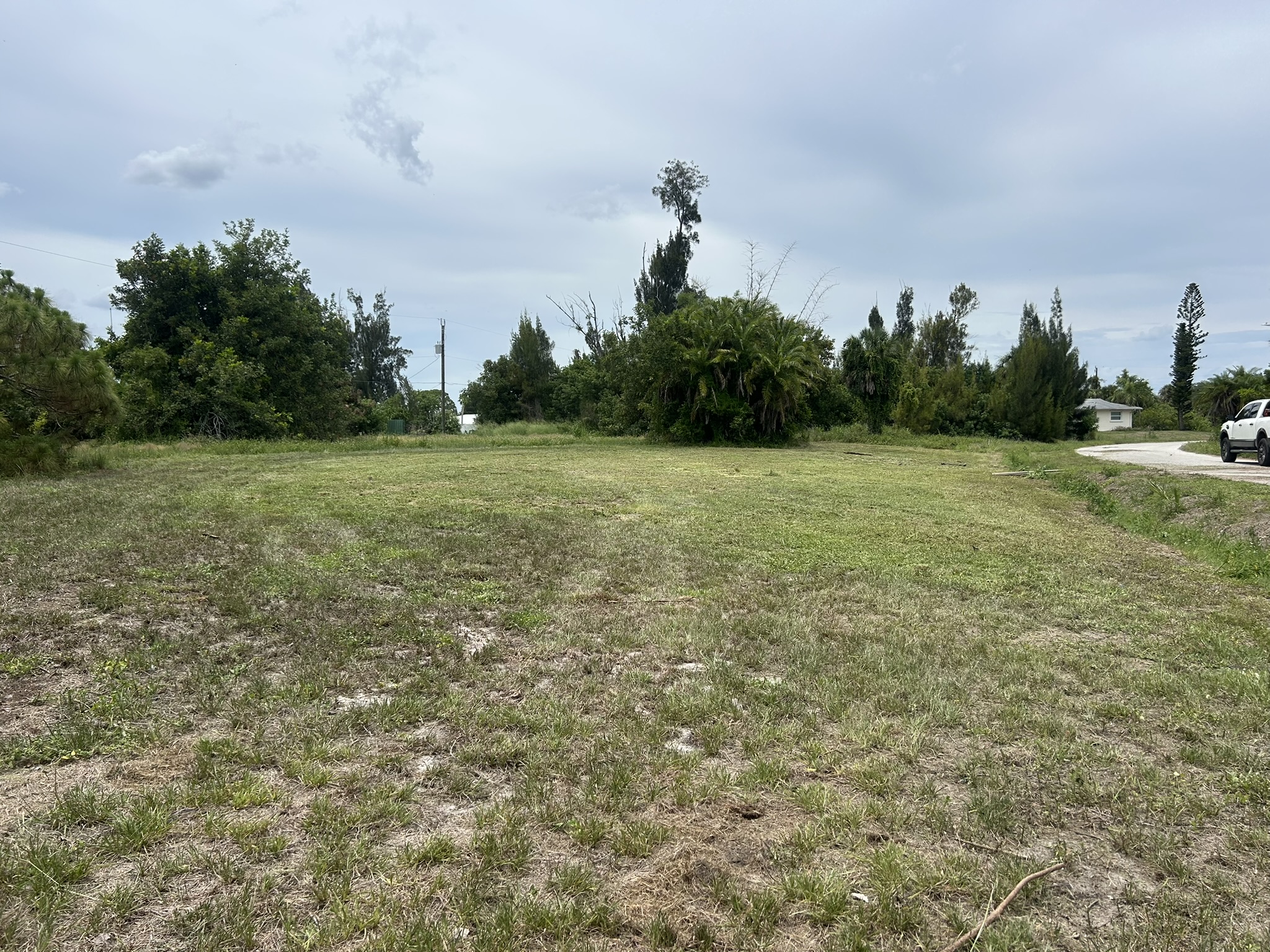 After mowing wide view of cleared overgrown lot in North Port